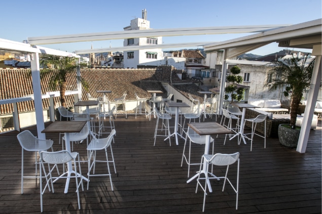 Space with tables at rooftop bar terraza de san juan in malaga